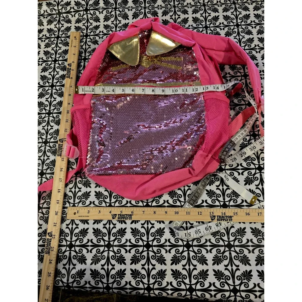 Bright pink sequin backpack. Gold Cat ears matching gold. Good. Few Minor Flaws.